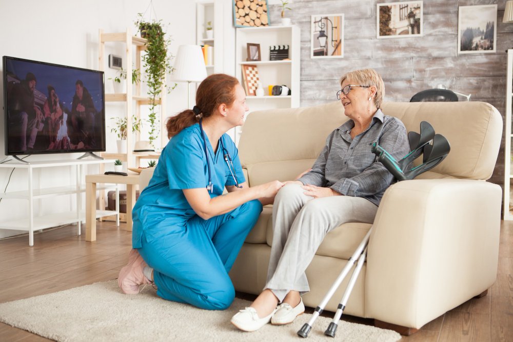 home care nurse helping elderly patient